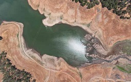 Aerial shot of reservoir showing drought impacts