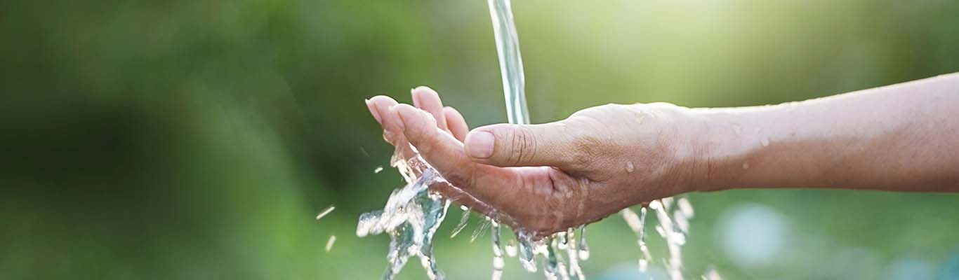 Hand under running water