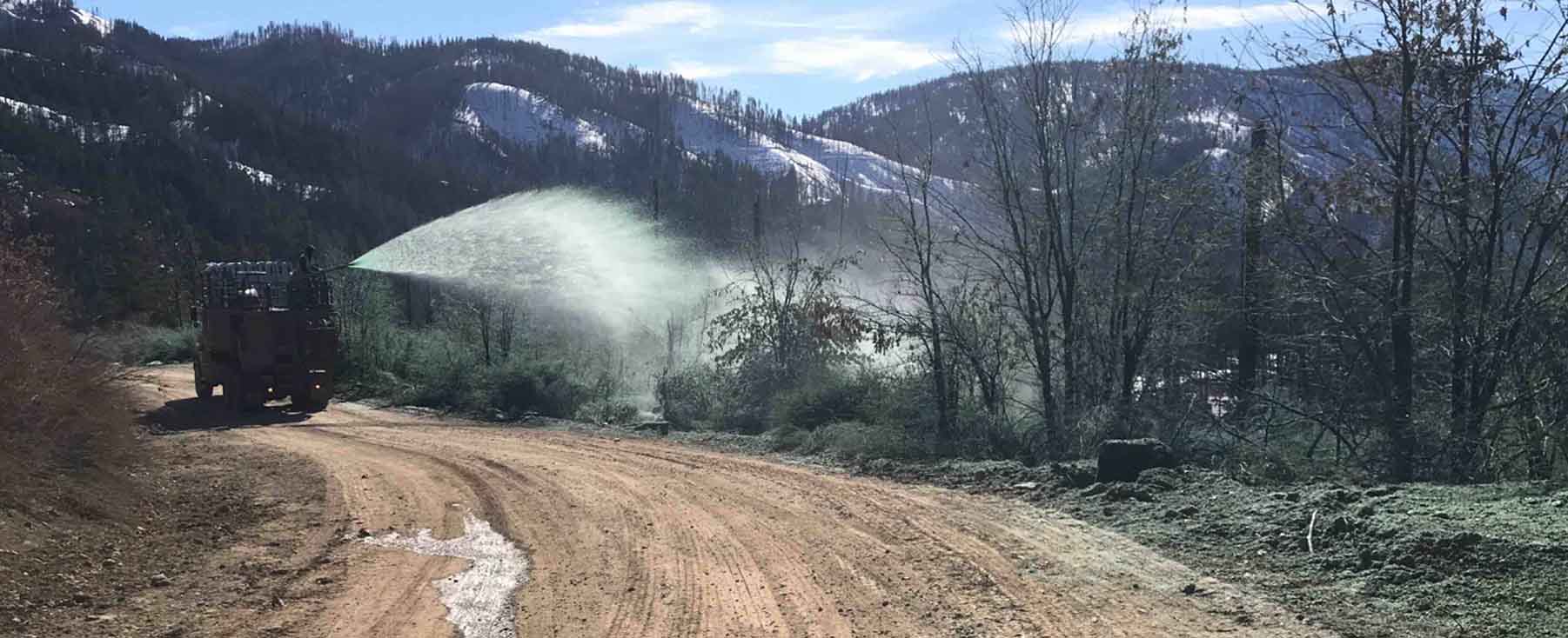 Truck applying erosion control material after Dixie Fire