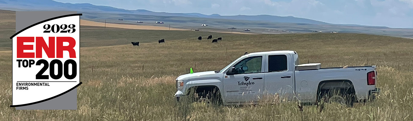 Trihydro truck in a field