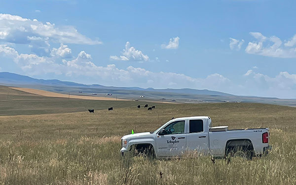 Trihydro truck in a field