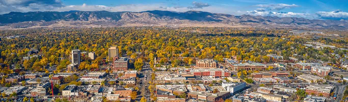 A big picture view of Fort Collins with mountains in the background
