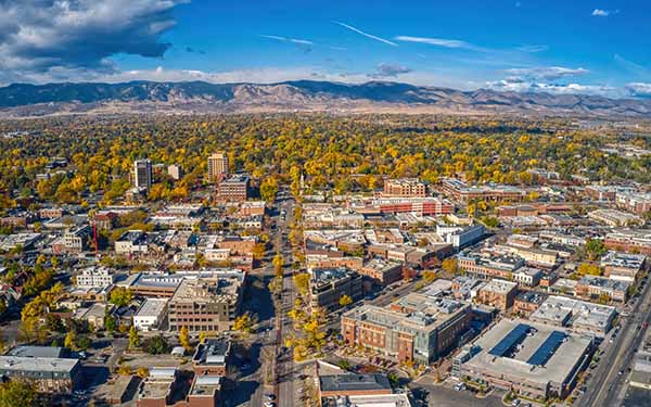 A big picture view of Fort Collins with mountains in the background