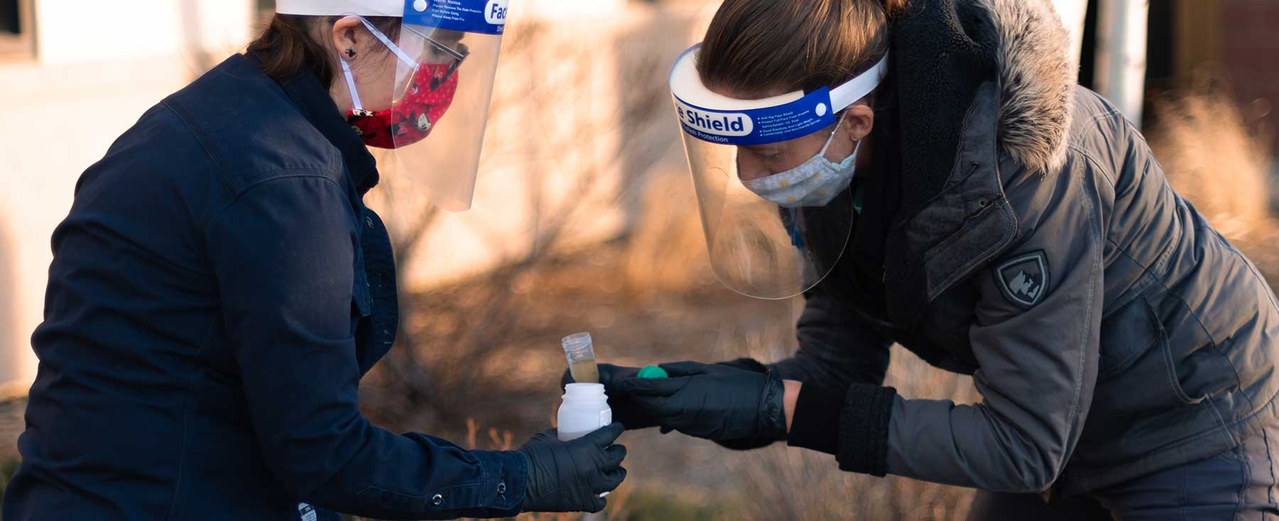 2 women sampling wastewater