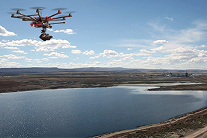 Drone flying against blue sky