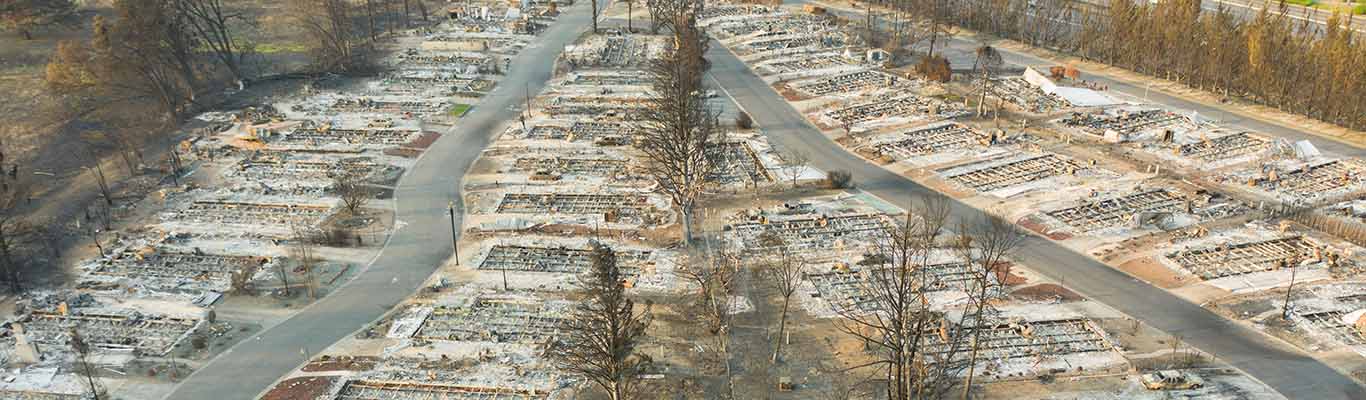 aerial view of neighborhood houses destroyed by wildfire